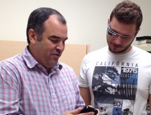 Scott Hudson, assistant professor of the CNET program shows CNET student, Jake Fulgham features of Google Glass.