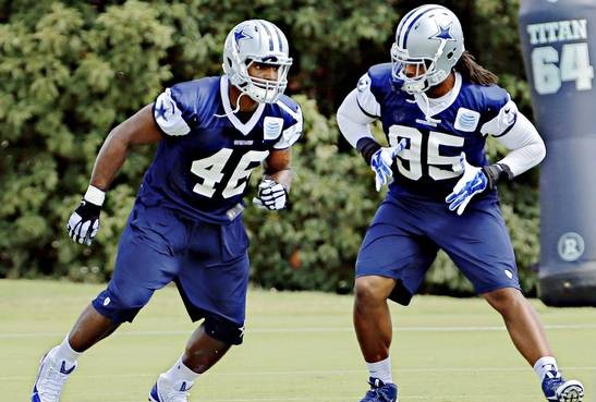 Dallas Cowboys practice squad player Michael Sam (left) and defensive end Lavar Edwards run a drill during practice Thursday, September 4, 2014 at their Valley Ranch facility in Irving, Texas. (G.J. McCarthy/The Dallas Morning News)