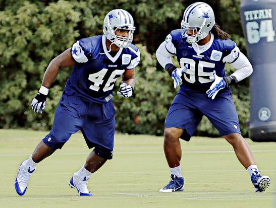 Dallas Cowboys practice squad player Michael Sam (left) and defensive end Lavar Edwards run a drill during practice Thursday, September 4, 2014 at their Valley Ranch facility in Irving, Texas. (G.J. McCarthy/The Dallas Morning News)
