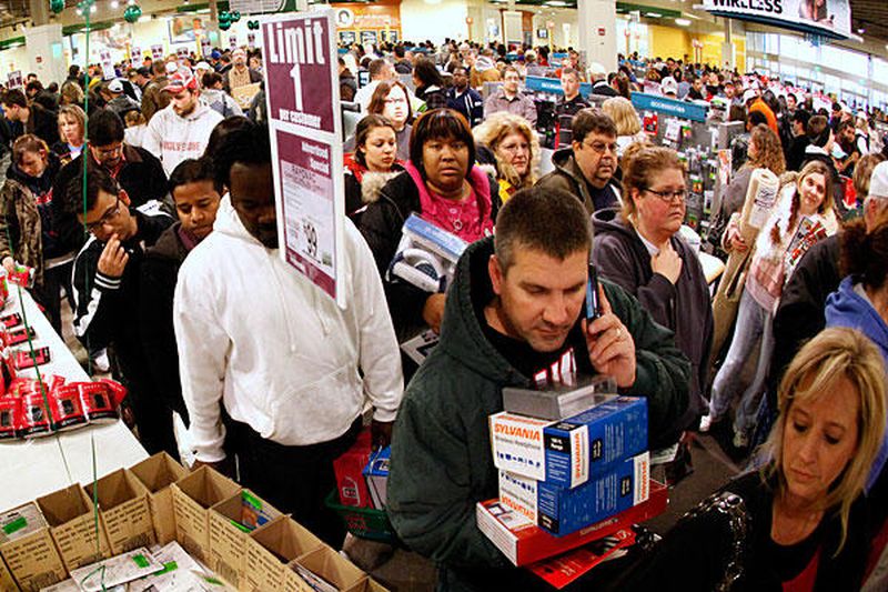Courtesy of forcechange.com. Shoppers wait patiently in line with their Black Friday sales.