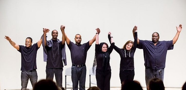 Photo provided by blueShadow Photography at http://bit.ly/1669OAh The Prison Performing Arts Alumni Troupe take their final bow after a performance.