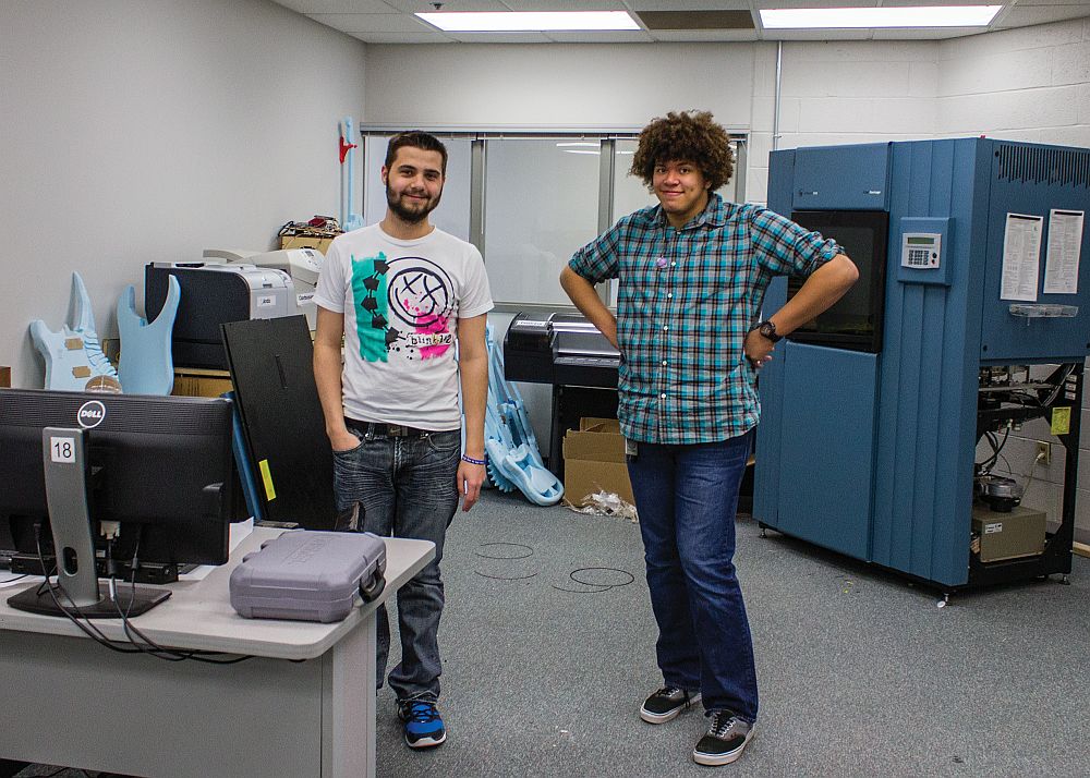 Photo by Julia Johnson Martin and Peterson standing in the 3D printing lab on the Lewis and Clark campus.