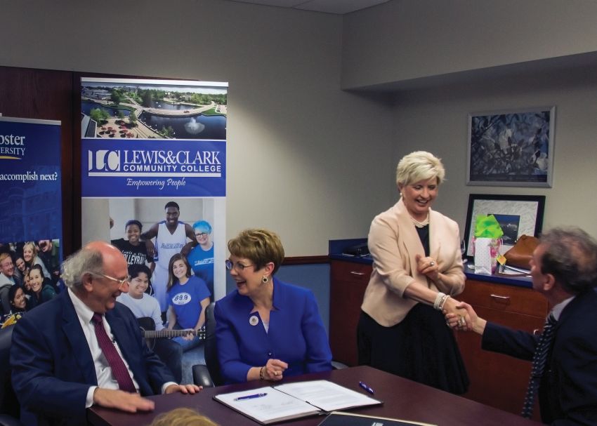 Photo by Julia Johnson Webster University President Elizabeth Stroble signs new nursing agreement with L&C President Dale Chapman.