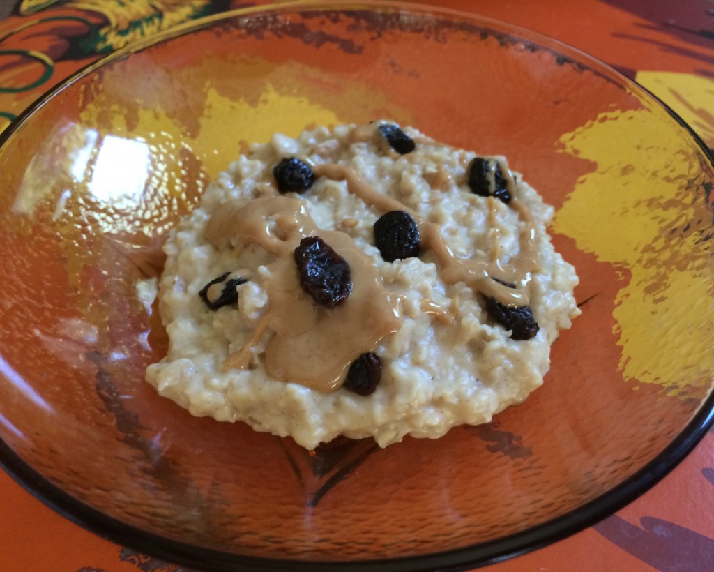 Peanut Butter oatmeal with raisins and peanut butter drizzled on top