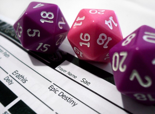 3 20 sided dice sit on a character sheet for dungeons and dragons