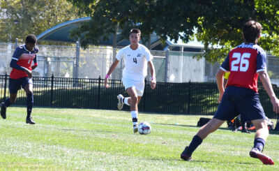 Number 4, Gino Buffa brings the ball down the field.