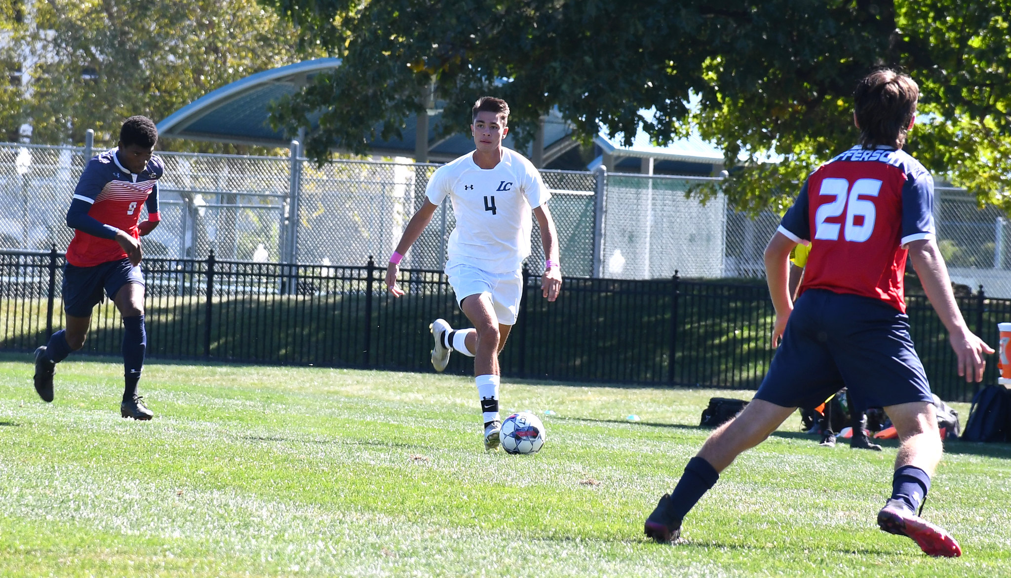 Number 4, Gino Buffa brings the ball down the field.
