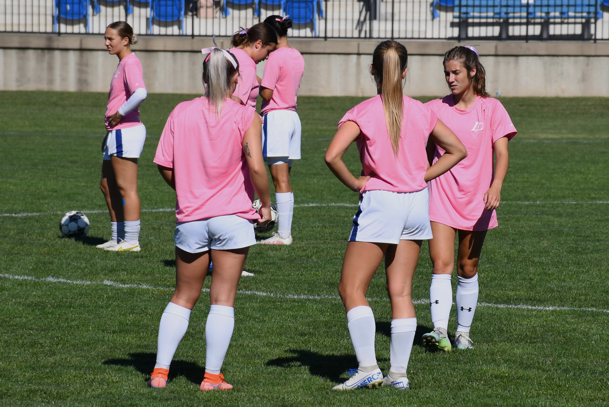 Girls Soccer Players warm up before the game.