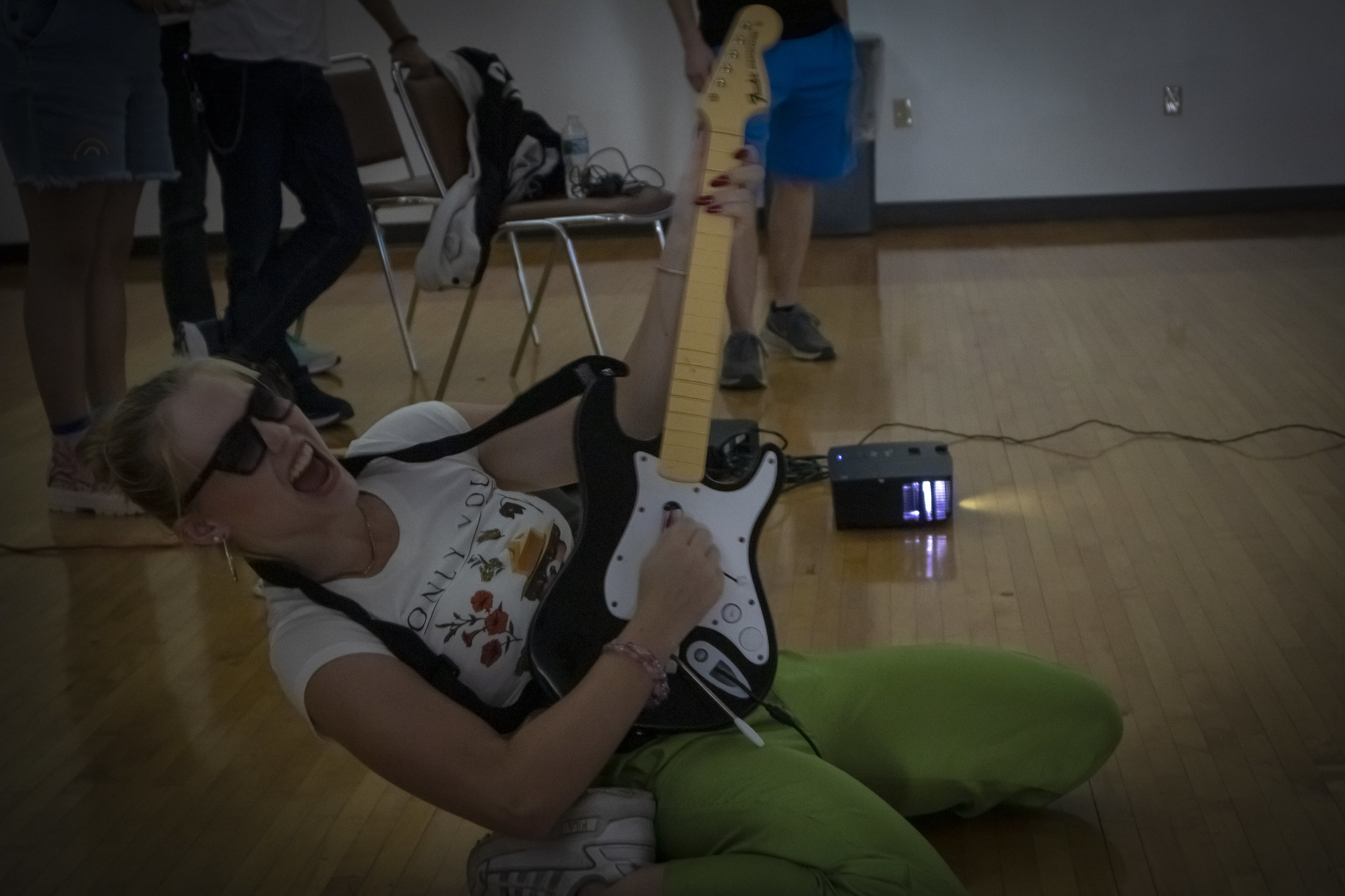 Student rocking out with game guitar