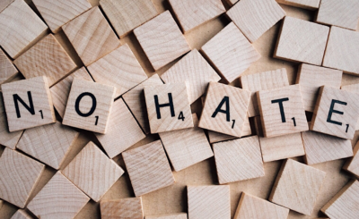 scrabble letters spelling "No Hate"