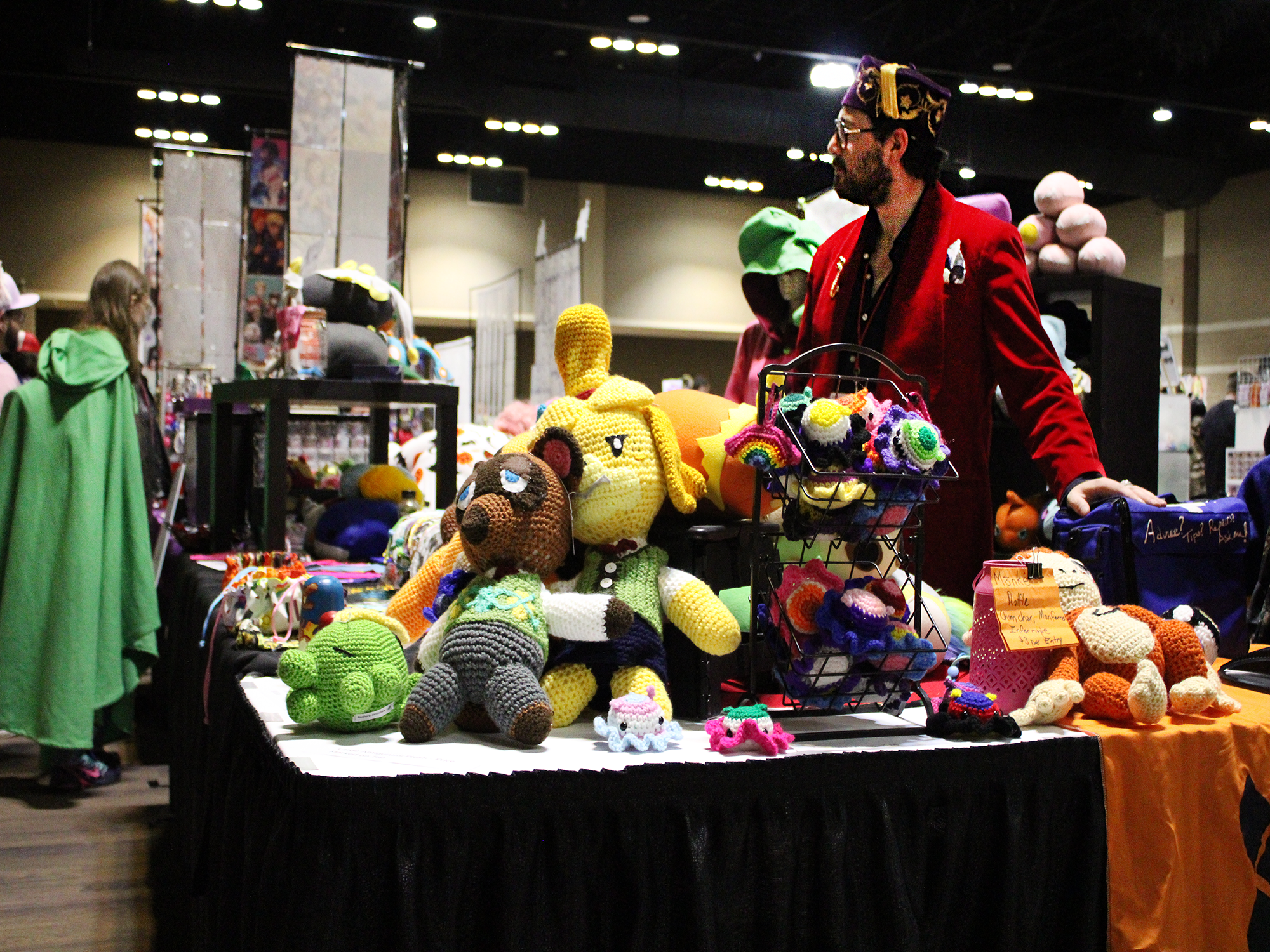 table with stuffed animals at anime convention